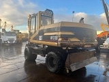 колесный экскаватор CATERPILLAR M318